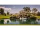 Scenic pond with waterfall feature and lush landscaping creates a serene setting on a sunny day at 4410 E Brusca Way, Pahrump, NV 89061