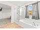 Bathroom featuring a shower, soaking tub with elegant fixtures, and natural light at 4533 Lime Straight Dr, Las Vegas, NV 89115