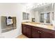 Bathroom featuring double sinks, granite countertops, and modern fixtures at 4533 Lime Straight Dr, Las Vegas, NV 89115