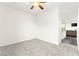 Neutral bedroom with neutral carpet and view to kitchen and living room at 4533 Lime Straight Dr, Las Vegas, NV 89115