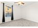 Empty bedroom with a window, ceiling fan, and neutral carpeting at 4533 Lime Straight Dr, Las Vegas, NV 89115