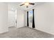 Bedroom featuring neutral carpeting, a window, and a ceiling fan at 4533 Lime Straight Dr, Las Vegas, NV 89115