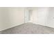 This cozy bedroom features neutral walls, plush carpet, and closet space at 4533 Lime Straight Dr, Las Vegas, NV 89115