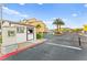 Gated community entrance with guard house and manicured landscaping at 4533 Lime Straight Dr, Las Vegas, NV 89115