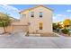 Two-story home showcasing a neutral stucco exterior, two-car garage, well-kept landscaping, and inviting curb appeal at 4533 Lime Straight Dr, Las Vegas, NV 89115