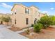 Charming two-story home with desert landscaping, neutral stucco exterior, arched entry and accent shutters at 4533 Lime Straight Dr, Las Vegas, NV 89115