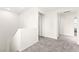Hallway with plush gray carpeting and neutral walls offers a bright and airy feel at 4533 Lime Straight Dr, Las Vegas, NV 89115