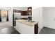 Bright kitchen with granite island, stainless steel appliances, and dark wood cabinets at 4533 Lime Straight Dr, Las Vegas, NV 89115