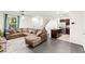 Spacious living room with sectional sofa, granite kitchen island, and modern stainless steel appliances at 4533 Lime Straight Dr, Las Vegas, NV 89115