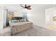 Bright main bedroom features a ceiling fan, neutral tones, and an ensuite bathroom with a tub at 4533 Lime Straight Dr, Las Vegas, NV 89115