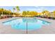 Community pool with lounge chairs and well-maintained landscaping for relaxation at 4533 Lime Straight Dr, Las Vegas, NV 89115