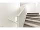 Carpeted staircase with white walls and handrail leading to the upper level of the home at 4533 Lime Straight Dr, Las Vegas, NV 89115