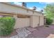 Exterior view of condo building with shrubbery and rock landscaping at 4770 Topaz St # 108, Las Vegas, NV 89121