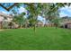 Exterior green space featuring manicured lawn and mature shade trees at 4770 Topaz St # 108, Las Vegas, NV 89121