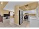 Open floor plan, kitchen features stainless steel appliances and white cabinets at 4770 Topaz St # 108, Las Vegas, NV 89121