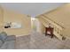 Inviting living room with tile flooring, stairs, and a charming electric fireplace at 4770 Topaz St # 108, Las Vegas, NV 89121