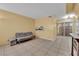 Cozy living room featuring tile flooring and a sliding glass door at 4770 Topaz St # 108, Las Vegas, NV 89121