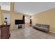 Bright living room featuring tile flooring, a large window, and neutral wall color at 4770 Topaz St # 108, Las Vegas, NV 89121