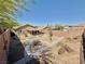Aerial view of a backyard with outdoor kitchen, covered patio and mature xeriscaped landscaping at 5019 Quiet Falls Ct, Las Vegas, NV 89141