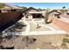 Fenced-in backyard with desert landscaping, a covered patio, and a brick perimeter at 5019 Quiet Falls Ct, Las Vegas, NV 89141