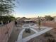 Landscaped backyard featuring a covered patio and modern walkway design in a desert environment at 5019 Quiet Falls Ct, Las Vegas, NV 89141