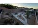 Spacious backyard with desert landscaping, modern walkway, and a covered patio, perfect for outdoor living at 5019 Quiet Falls Ct, Las Vegas, NV 89141