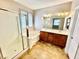 Bathroom boasts a large tub, walk-in shower, and double sink vanity at 5019 Quiet Falls Ct, Las Vegas, NV 89141