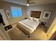 A serene bedroom boasts soft lighting, neutral tones, and a comfortable king-sized bed at 5019 Quiet Falls Ct, Las Vegas, NV 89141