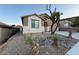 Charming single-story home with desert landscaping and neutral colored exterior at 5019 Quiet Falls Ct, Las Vegas, NV 89141