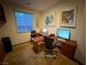 A spacious office offers dual workstations, ample lighting, and room for productivity at 5019 Quiet Falls Ct, Las Vegas, NV 89141