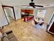 Open-concept living area with island kitchen, dining table, and comfortable sofa at 5019 Quiet Falls Ct, Las Vegas, NV 89141