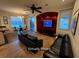Open concept living area with a breakfast nook and a flat screen television at 5019 Quiet Falls Ct, Las Vegas, NV 89141