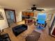 Open living space with granite kitchen island, and adjacent dining area at 5019 Quiet Falls Ct, Las Vegas, NV 89141