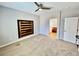 Spacious main bedroom features neutral paint, plush carpeting, and an ensuite bathroom for privacy and relaxation at 5019 Quiet Falls Ct, Las Vegas, NV 89141