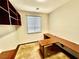 Office with built-in shelving and ample workspace by the window at 5019 Quiet Falls Ct, Las Vegas, NV 89141