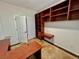 Bright office with built-in cabinets and a spacious corner desk at 5019 Quiet Falls Ct, Las Vegas, NV 89141