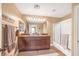 Bathroom featuring double vanity, granite counters, and shower-over-tub at 5021 Apache Valley Ave, Las Vegas, NV 89131