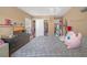 Bedroom with a queen bed, closet, and dresser, creating a comfortable living space at 5021 Apache Valley Ave, Las Vegas, NV 89131