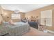 Bedroom with queen bed, desk, and ample natural light, perfect for a home office at 5021 Apache Valley Ave, Las Vegas, NV 89131