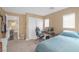 Bedroom with queen bed, desk, and ample natural light, creating a great space at 5021 Apache Valley Ave, Las Vegas, NV 89131