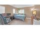 Comfortable bedroom with a queen bed, desk, and ample natural light at 5021 Apache Valley Ave, Las Vegas, NV 89131