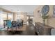 Inviting dining area with stylish lighting, dark wood floors, and seating for six at 5021 Apache Valley Ave, Las Vegas, NV 89131