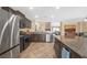 Modern kitchen featuring stainless steel appliances, granite countertops, and a kitchen island at 5021 Apache Valley Ave, Las Vegas, NV 89131