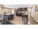 Spacious kitchen with dark cabinets, stainless appliances, and an island with bar stools at 5021 Apache Valley Ave, Las Vegas, NV 89131
