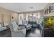 Cozy living room with comfortable seating, a large aquarium, and natural light at 5021 Apache Valley Ave, Las Vegas, NV 89131