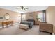 Relaxing main bedroom with a king-size bed, sitting area, and neutral decor at 5021 Apache Valley Ave, Las Vegas, NV 89131