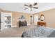 Spacious main bedroom featuring a king-size bed, dresser, and a sitting area at 5021 Apache Valley Ave, Las Vegas, NV 89131