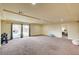 Spacious basement featuring neutral carpet, ample natural light, and versatile space for recreation and relaxation at 5448 Tulip Hill Ave, Las Vegas, NV 89141
