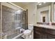 Bathroom with a modern glass-enclosed shower, stylish tile accents, and a dark single sink vanity at 5448 Tulip Hill Ave, Las Vegas, NV 89141