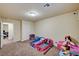 Cozy bedroom with playful decor, ample space and access to other rooms, perfect for a room at 5448 Tulip Hill Ave, Las Vegas, NV 89141
